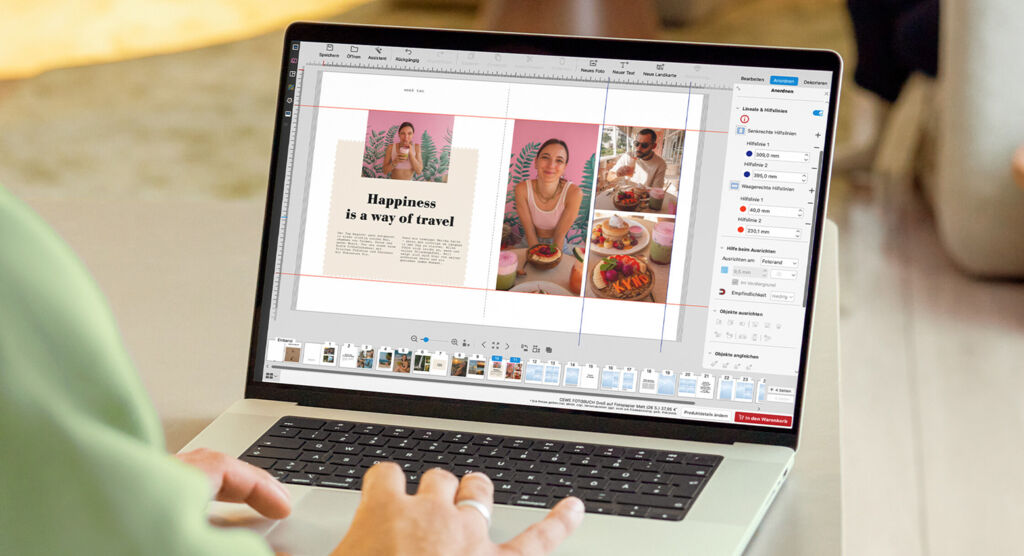 Eine Person erstellt ein CEWE FOTOBUCH auf einem Laptop.