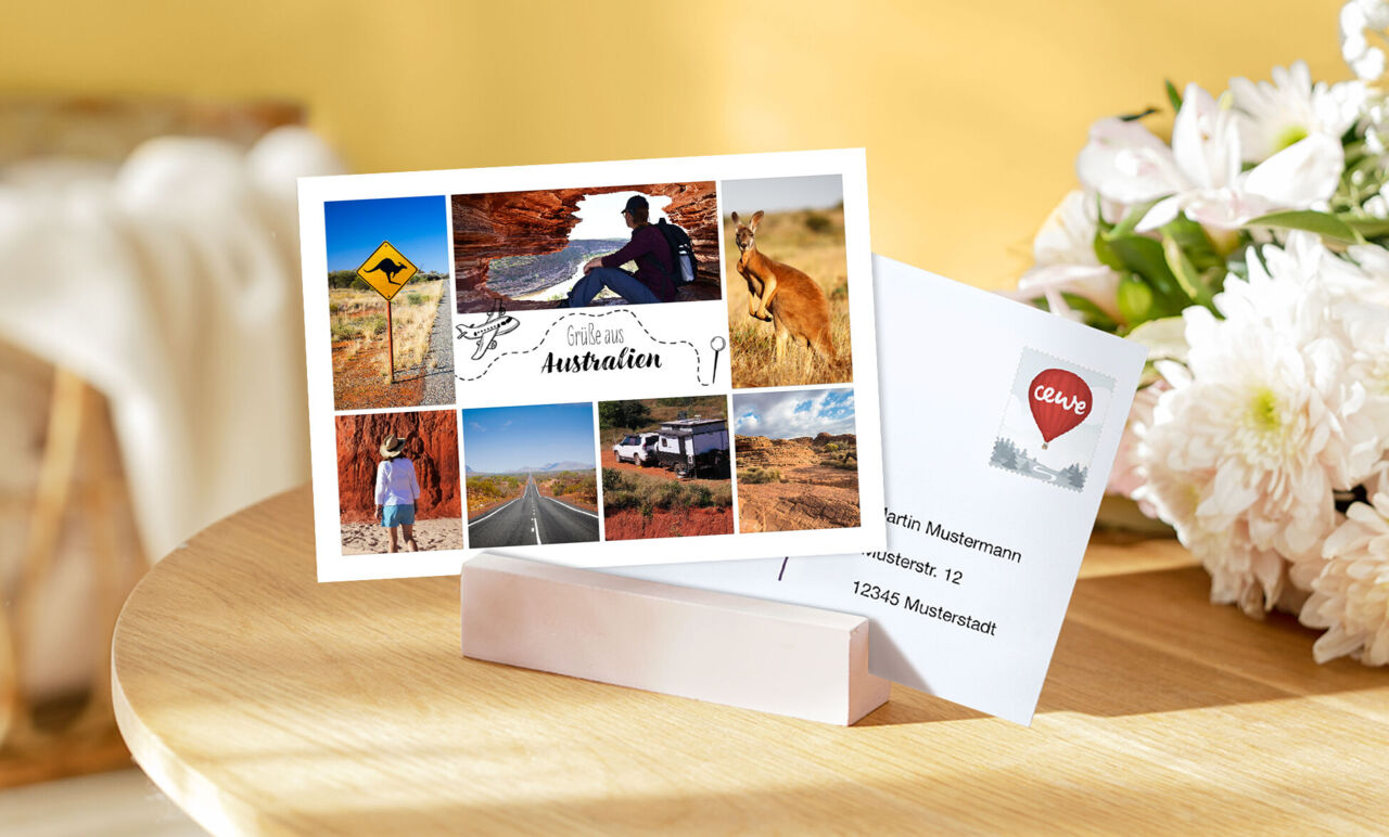 Postkarte mit Australien-Collage aus Känguru, roter Wüste, Landschaften und Wohnmobil mit dem Text: „Grüße aus Australien“